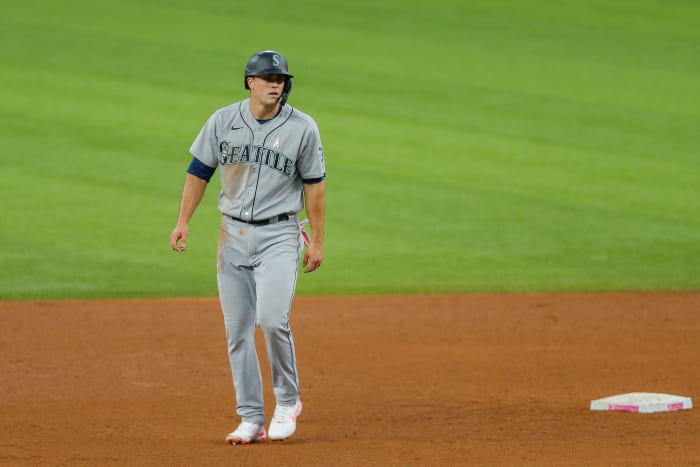 May 9, 2021; Arlington, Texas, USA; Seattle Mariners first baseman Evan White (12) leads off from second base during the fifth inning against the Texas Rangers at Globe Life Field. Mandatory Credit: Andrew Dieb-USA TODAY Sports